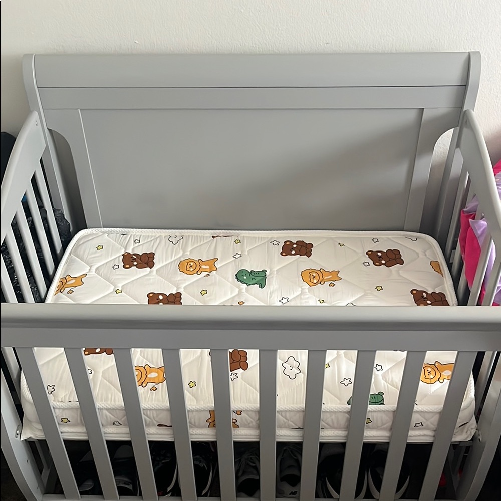 Gray Baby Crib with Printed Mattress